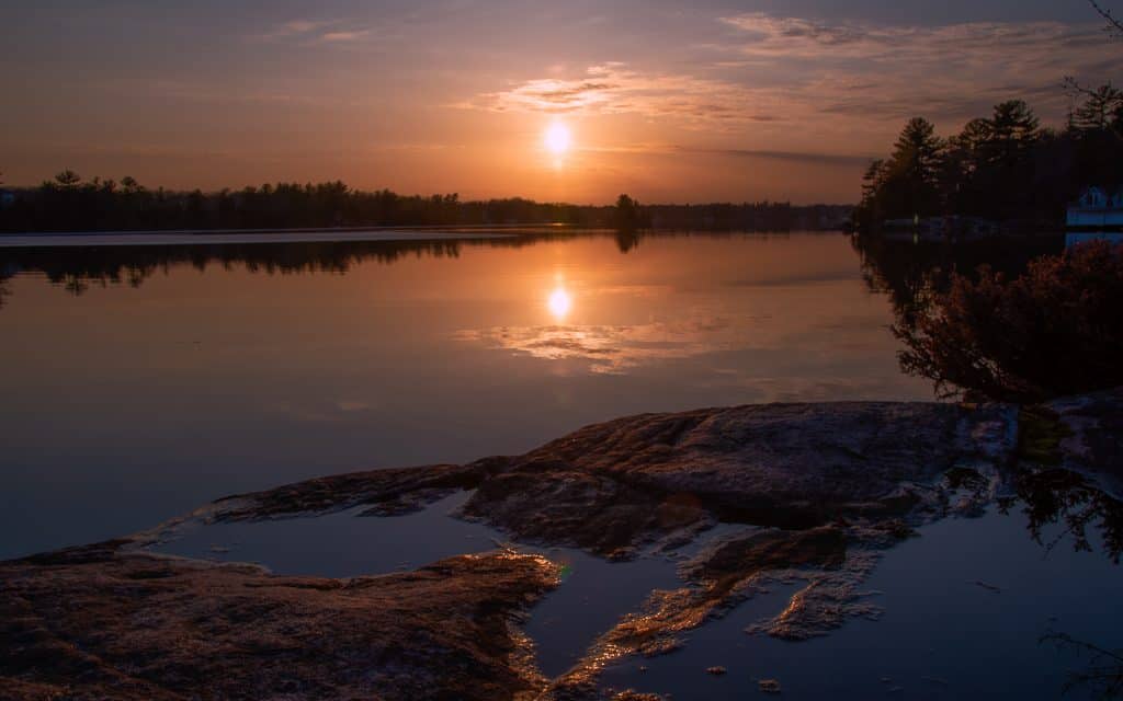 An early spring sunset over Morrison Lake and reflecting in the water.